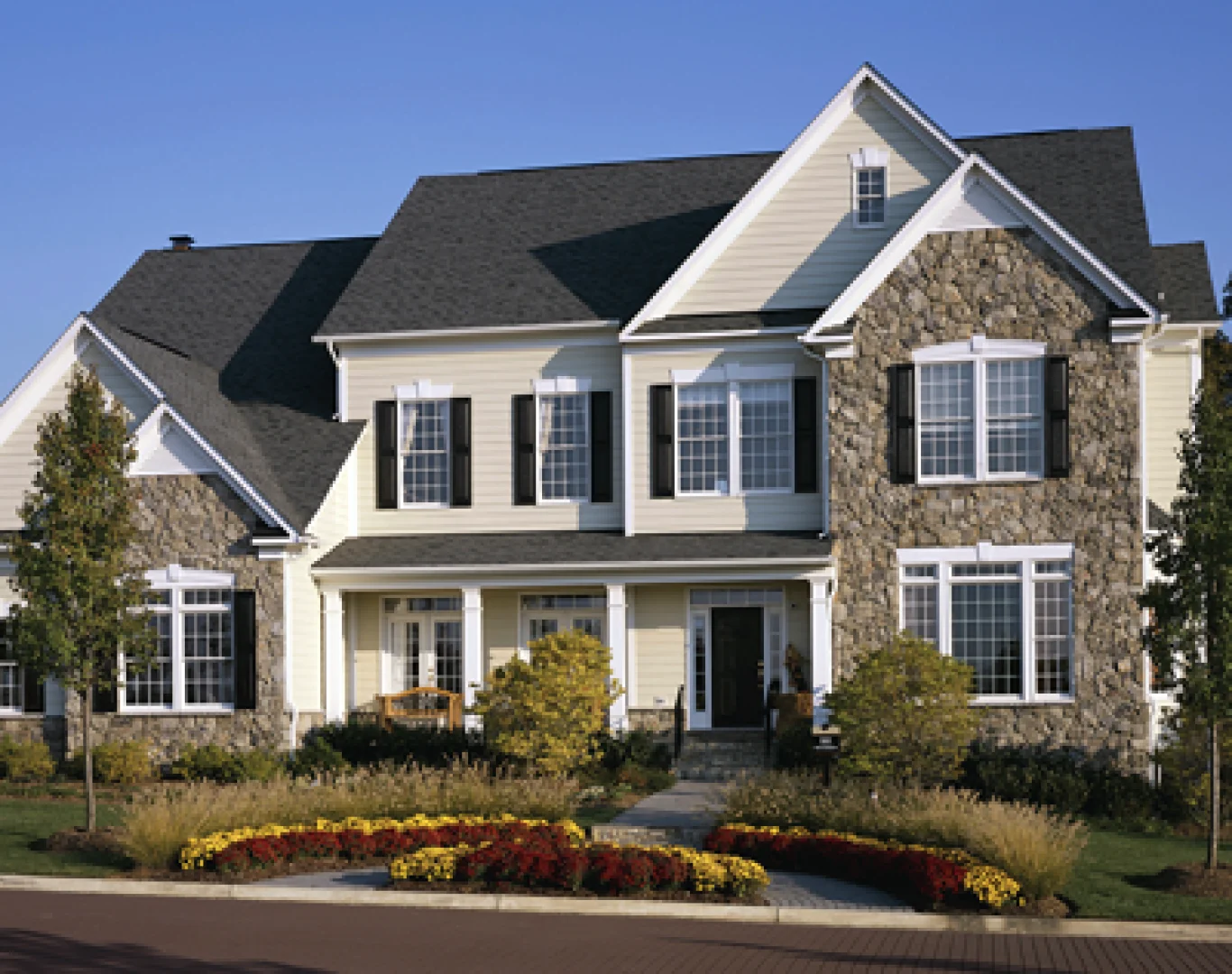 Before and after view of a home's exterior renovation by AG Exterior Solutions