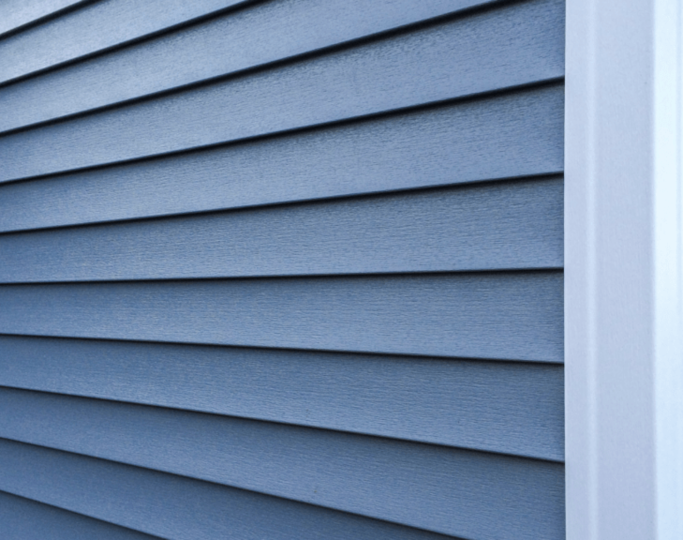 Professional siding installation in Hendersonville, TN, featuring new vinyl siding on a residential home.