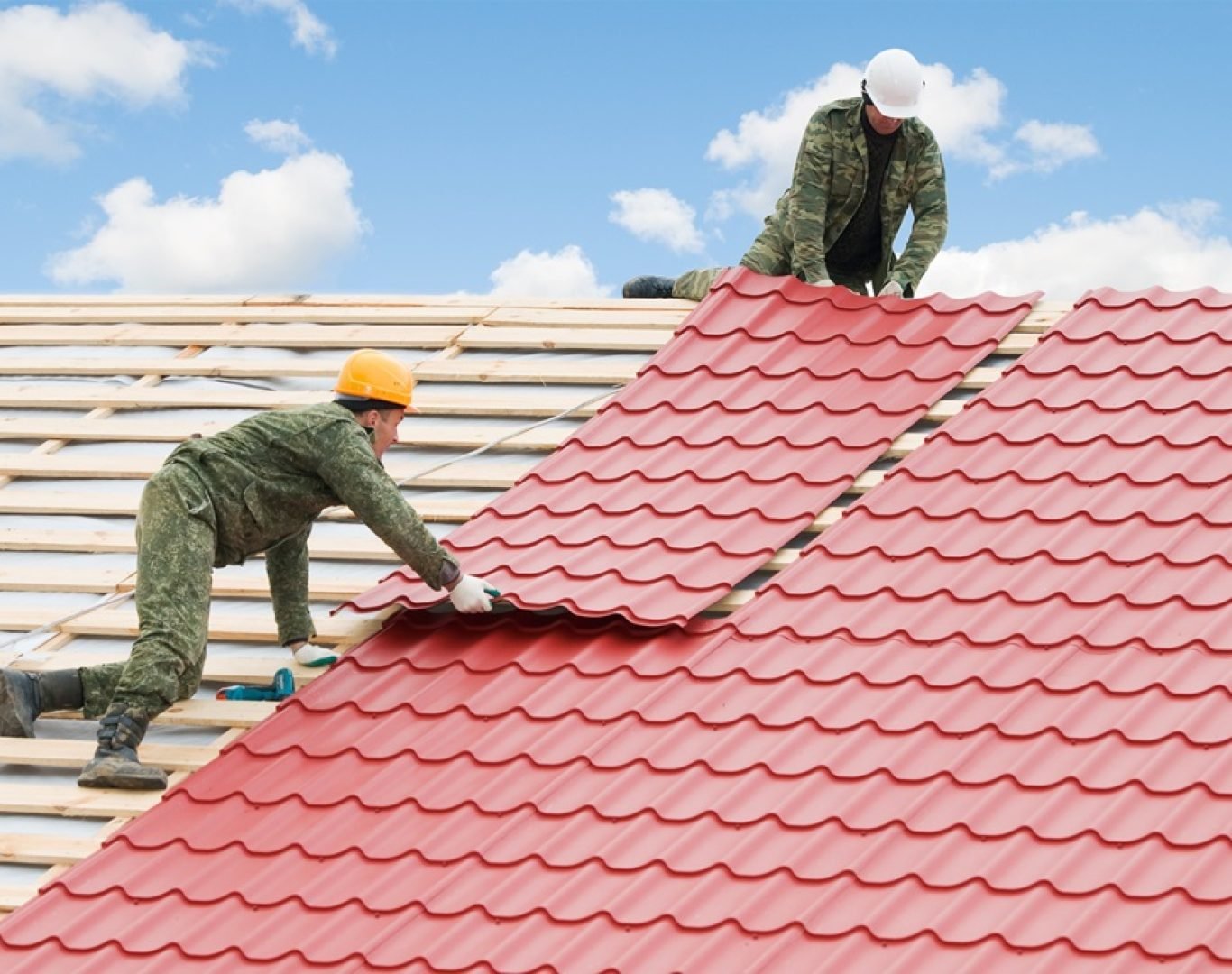 roof repair technicians working on damaged shingles in Gallatin, TN