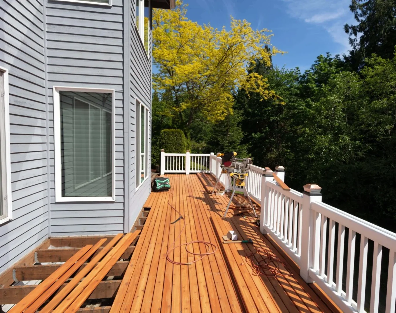 AG Exterior Solutions team repairing and restoring a wooden deck in Hendersonville, TN.